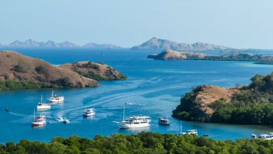 Boats traveling between islands in Komodo National Park
