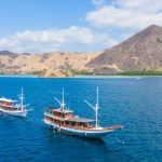 Liveaboard boats cruising through Komodo National Park waters